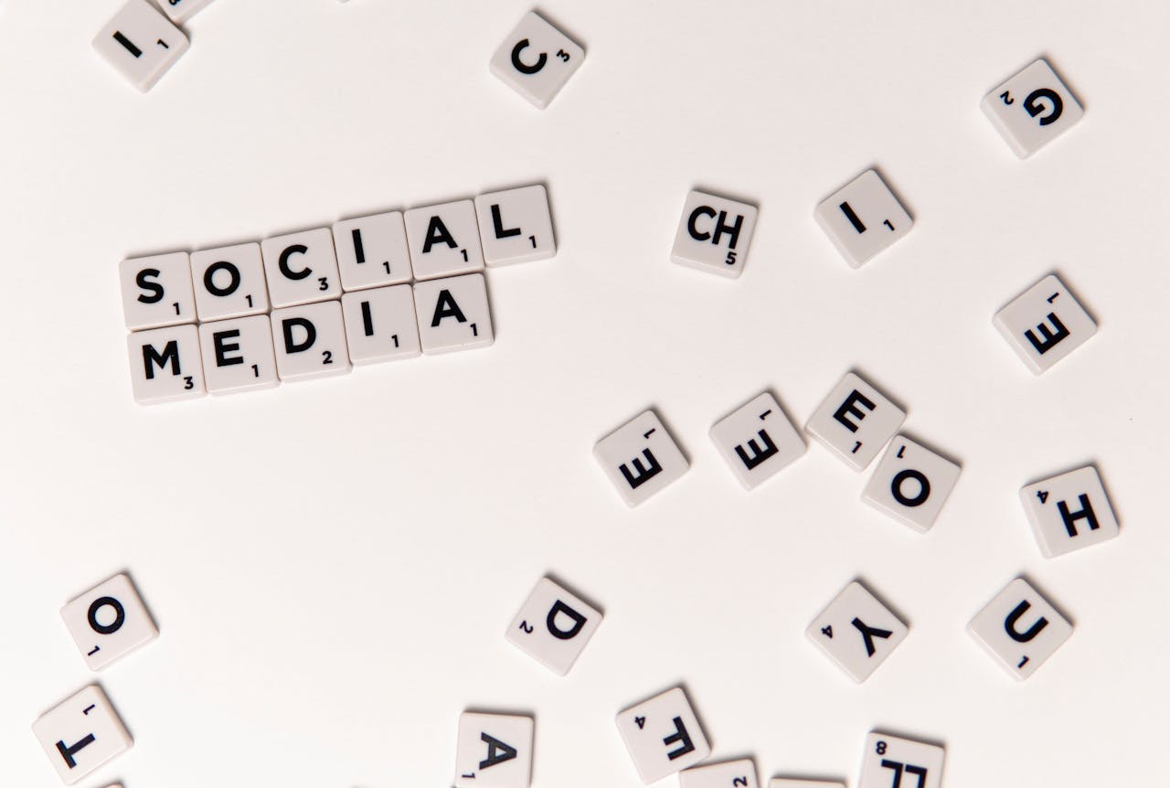cta-bg Scrabble tiles spelling Social Media on a white background, symbolizing digital communication.