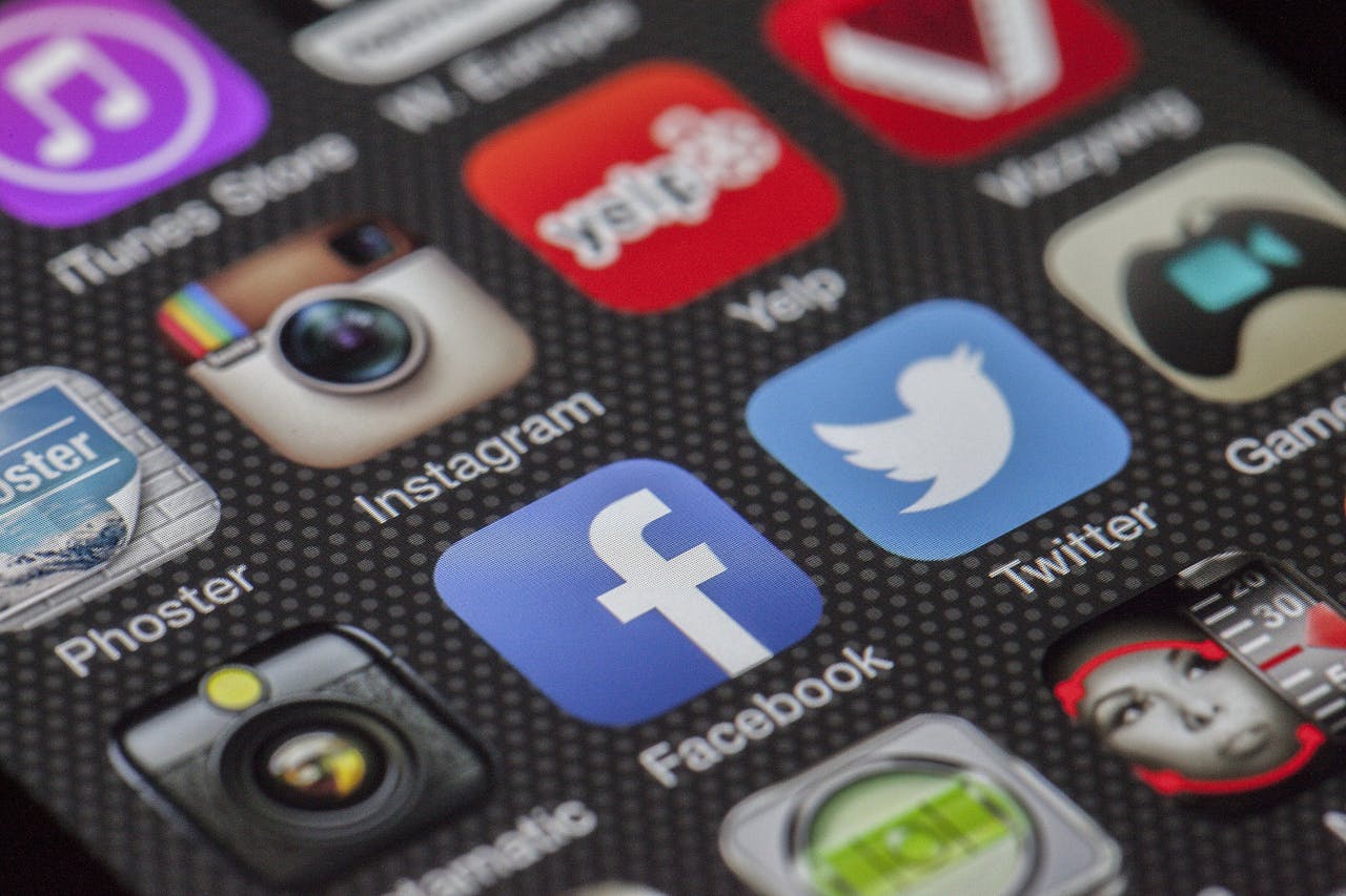 home-services-03 Close-up image of various social media app icons on a smartphone screen.